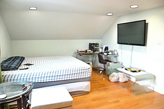 a bedroom with a bed and furniture