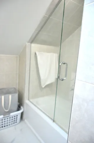 a white toilet sitting next to a bathroom sink