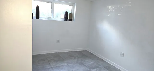 a room with furniture and a mirror