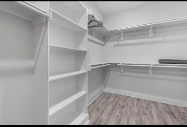a view of an empty walk in closet