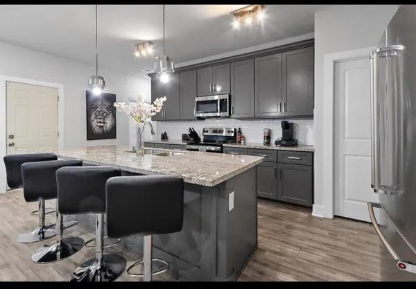 a kitchen with a sink cabinets and window