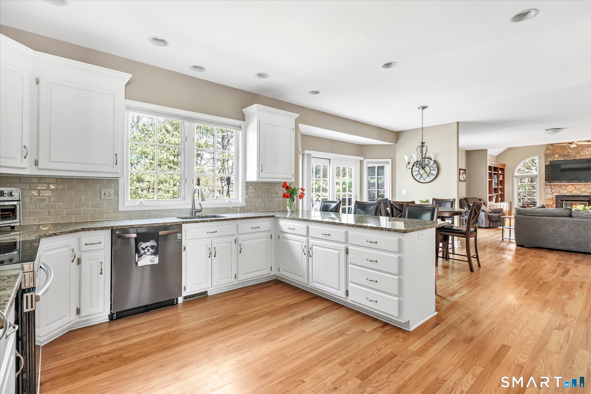 111 Stones Throw Trumbull, CT 06611 - Photo 14 of 47 a kitchen with granite countertop a stove top oven sink and cabinets