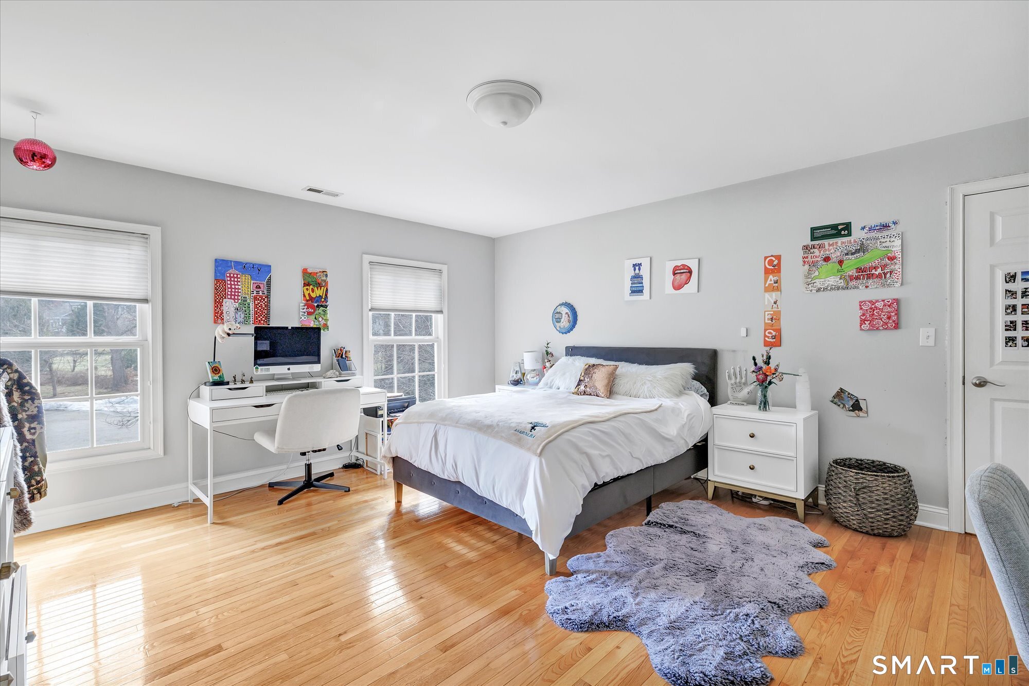 111 Stones Throw Trumbull, CT 06611 - Photo 28 of 47 a bedroom with a bed and a wooden floor