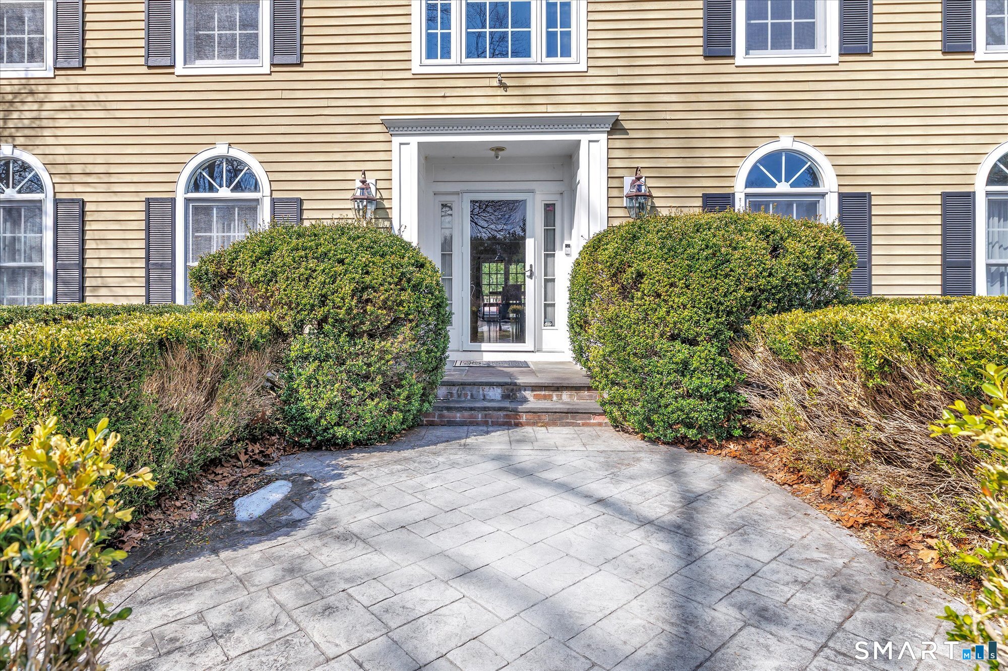 111 Stones Throw Trumbull, CT 06611 - Photo 3 of 47 a front view of a house with garden