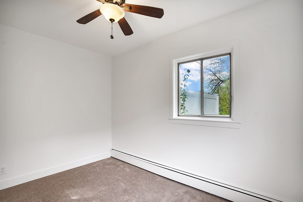 45 Horseshoe Drive, Unit 45 Chicopee, MA 01022 - Photo 16 of 31 an empty room with windows and fan