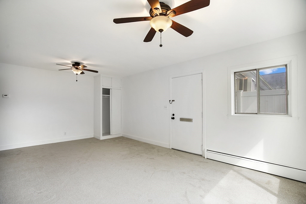 45 Horseshoe Drive, Unit 45 Chicopee, MA 01022 - Photo 20 of 31 wooden floor in an empty room with a window