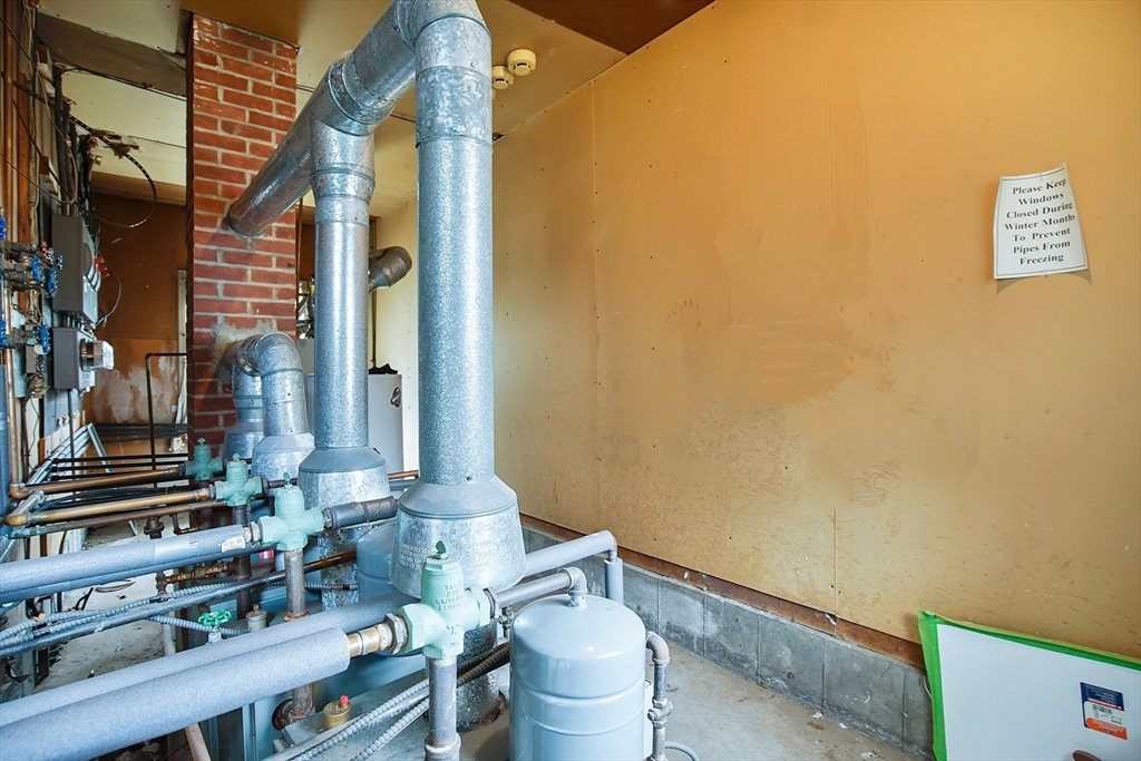 45 Horseshoe Drive, Unit 45 Chicopee, MA 01022 - Photo 22 of 31 a bathroom with a toilet and a mirror