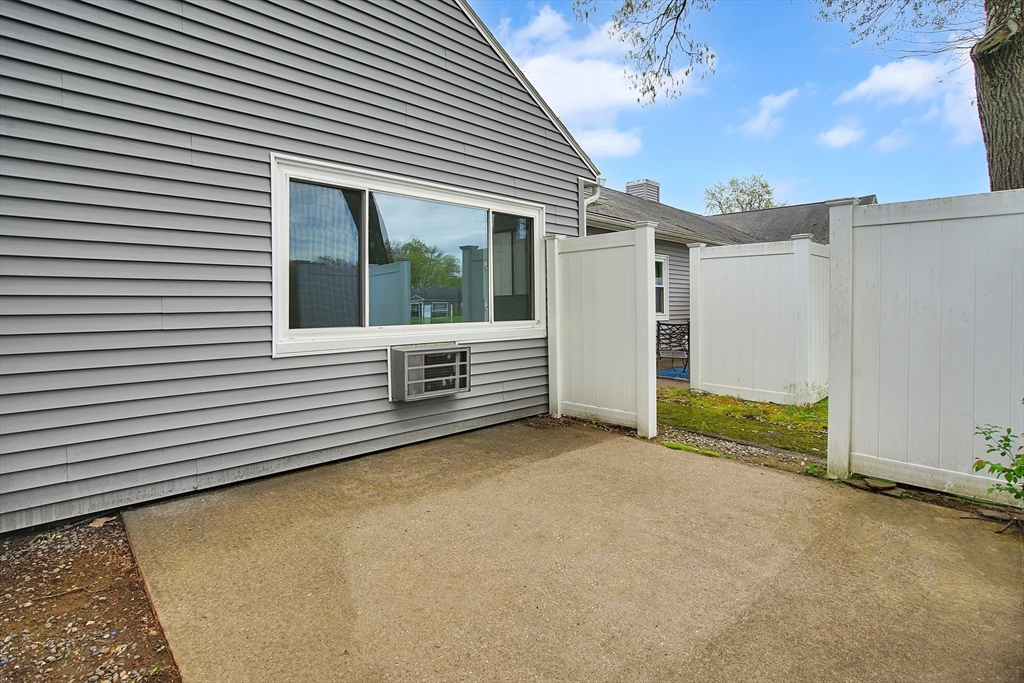 45 Horseshoe Drive, Unit 45 Chicopee, MA 01022 - Photo 25 of 31 a view of a house with a yard and balcony