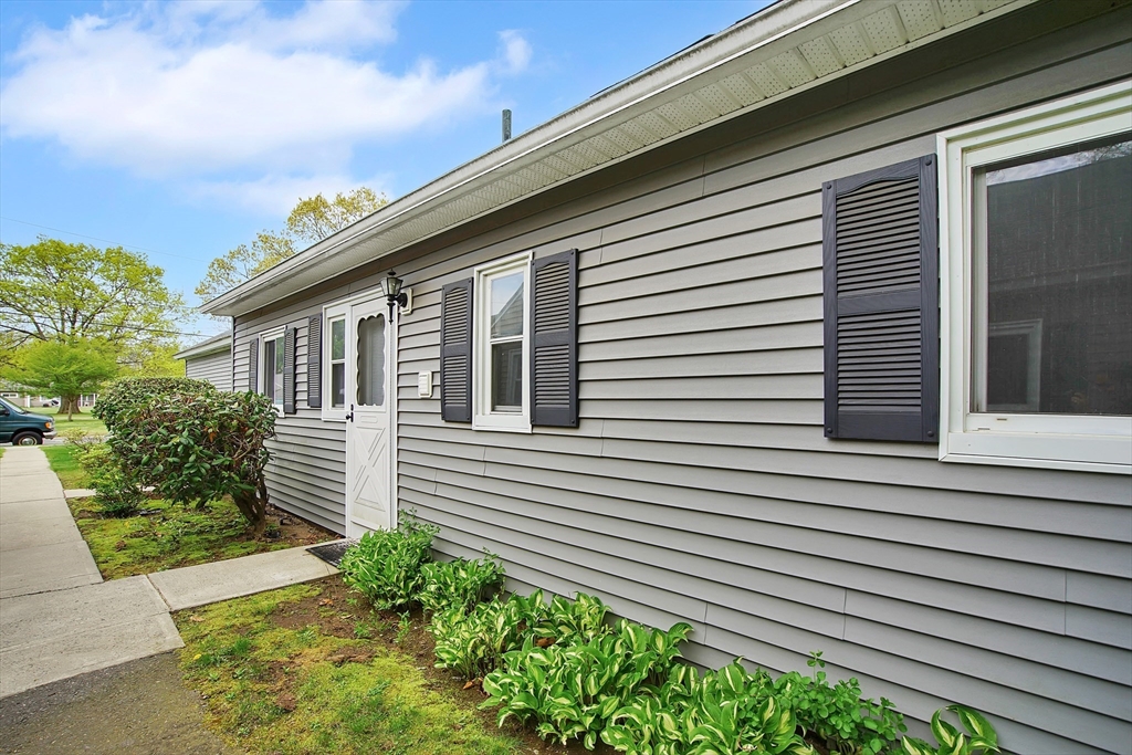 45 Horseshoe Drive, Unit 45 Chicopee, MA 01022 - Photo 26 of 31 a front view of a house with a yard