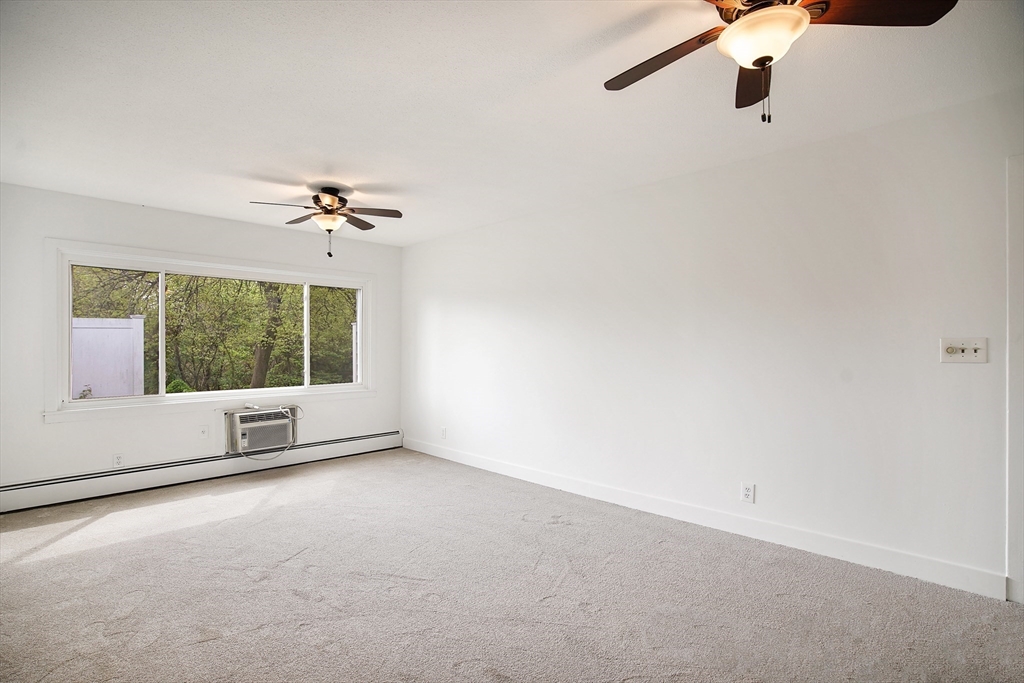 45 Horseshoe Drive, Unit 45 Chicopee, MA 01022 - Photo 5 of 31 a view of an empty room with a window