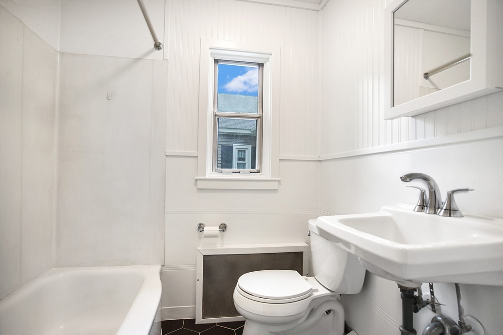 45 Horseshoe Drive, Unit 45 Chicopee, MA 01022 - Photo 8 of 31 a bathroom with a sink a toilet and bathtub