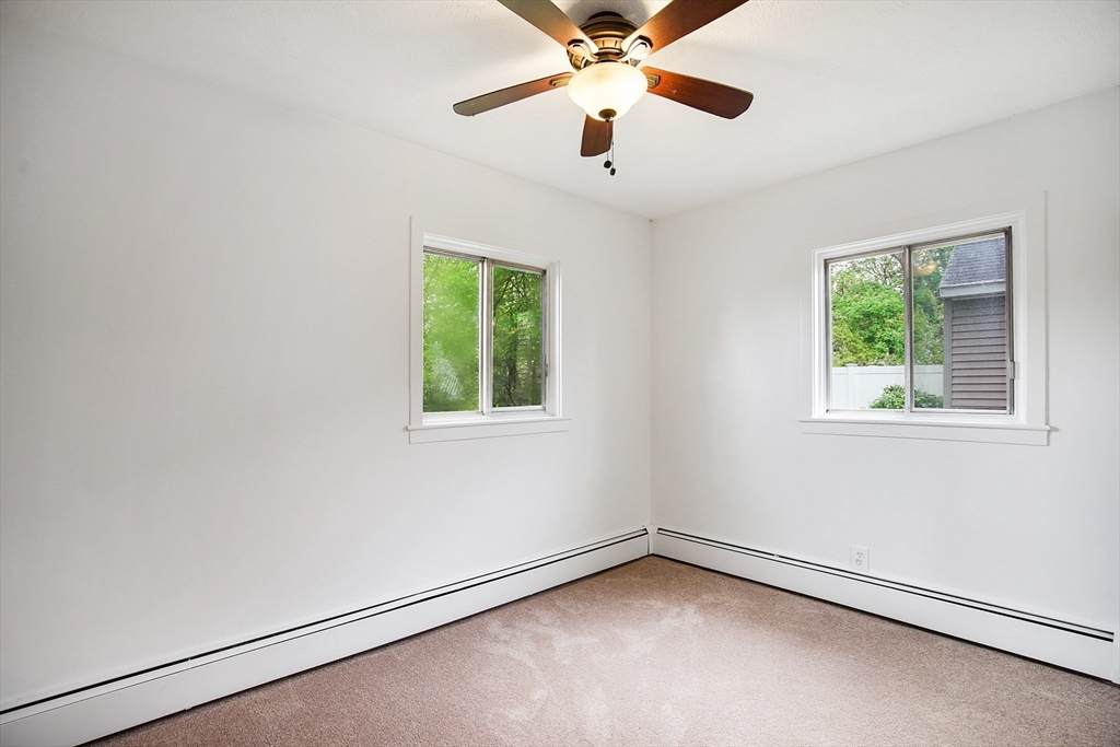 45 Horseshoe Drive, Unit 45 Chicopee, MA 01022 - Photo 9 of 31 an empty room with a window and a fan