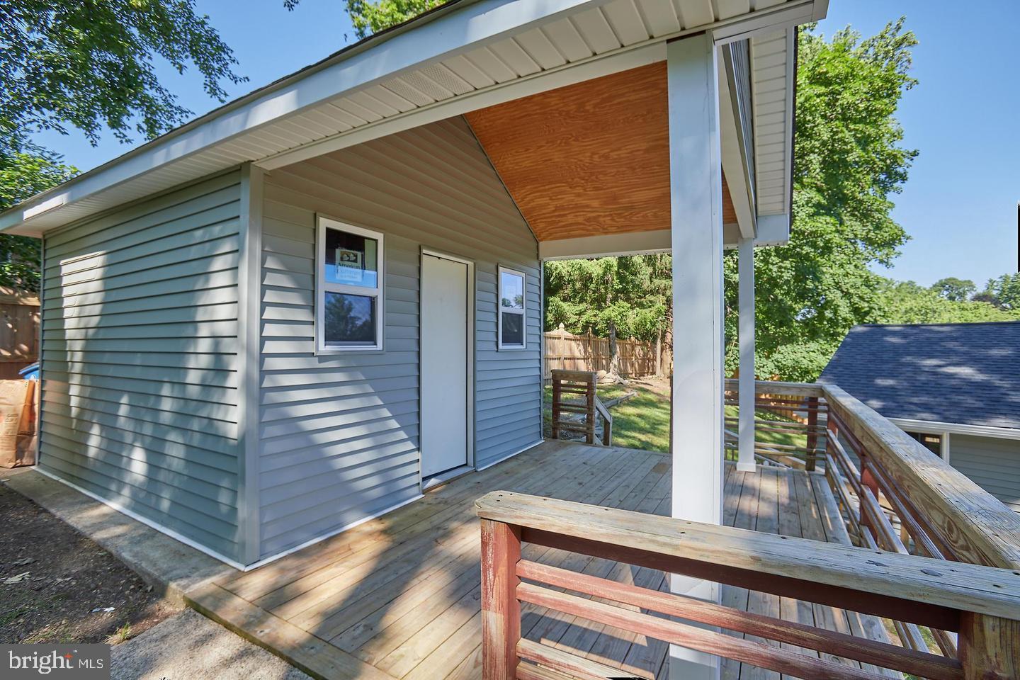 1007 Venice Drive Silver Spring, MD 20904 - Photo 35 of 39 a view of a porch with wooden floor and stairs