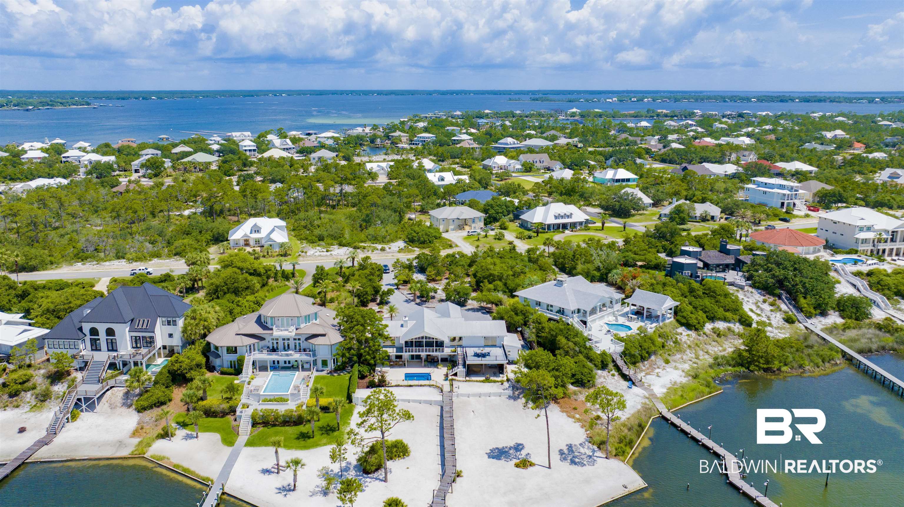 30538 River Road Orange Beach, AL 36561 - Photo 74 of 78 Aerial view of residential area with a nearby body of water