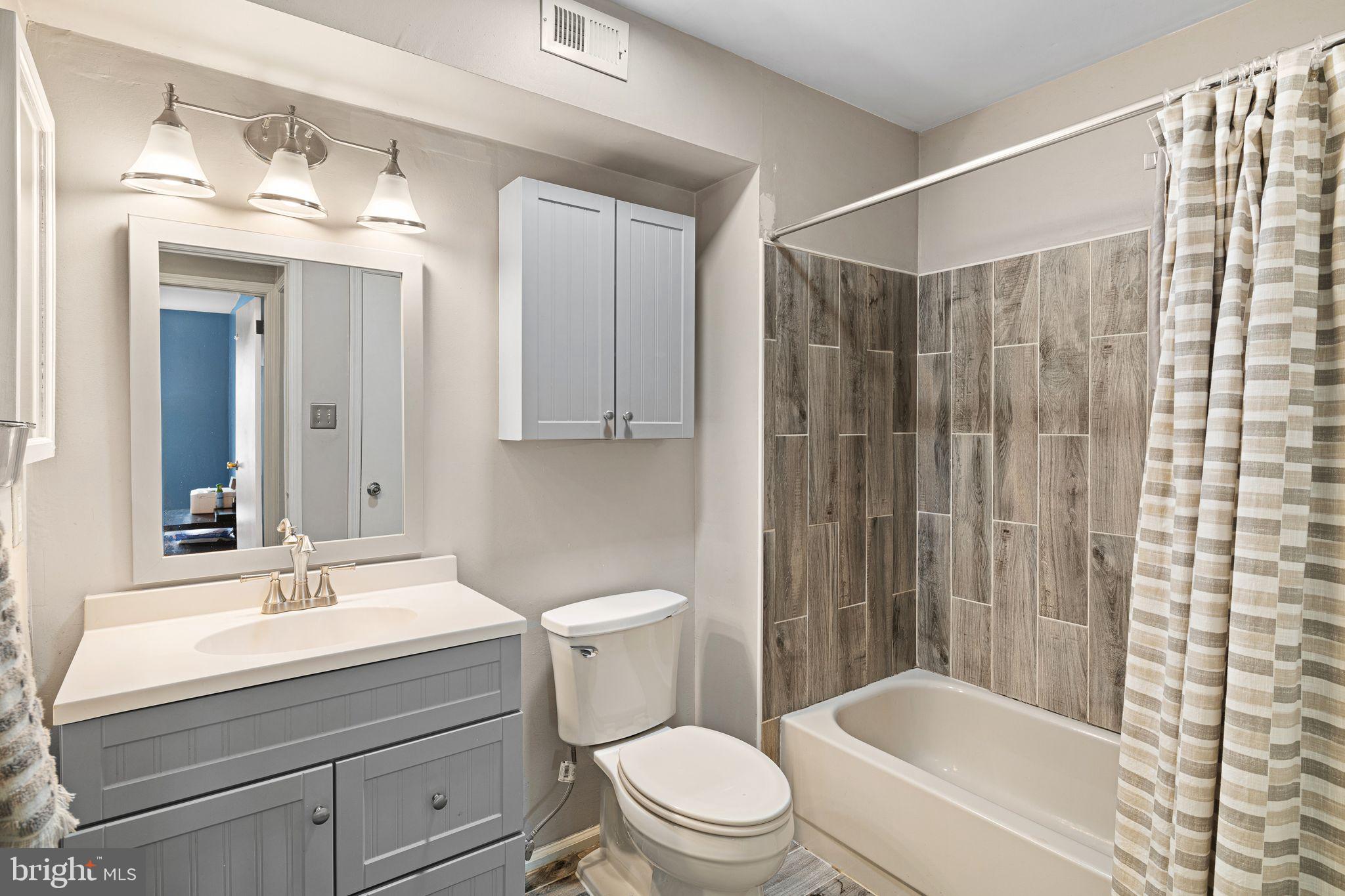 505 A Ralston Drive Mount Laurel, NJ 08054 - Photo 15 of 18 a bathroom with a sink a toilet a mirror and shower