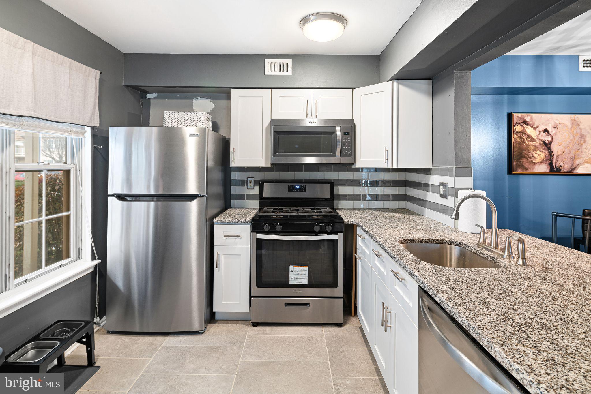 505 A Ralston Drive Mount Laurel, NJ 08054 - Photo 2 of 18 a kitchen with granite countertop a refrigerator stove and sink