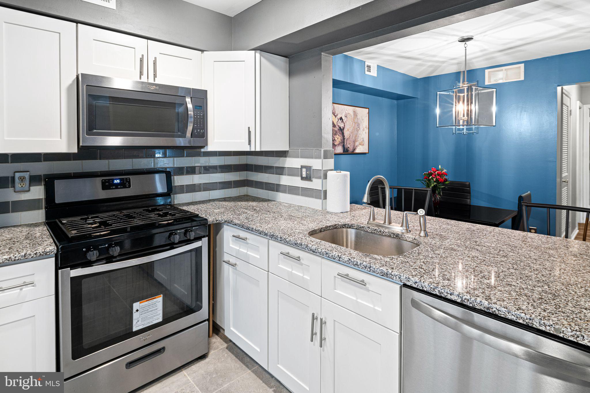 505 A Ralston Drive Mount Laurel, NJ 08054 - Photo 4 of 18 a kitchen with granite countertop a stove and a microwave