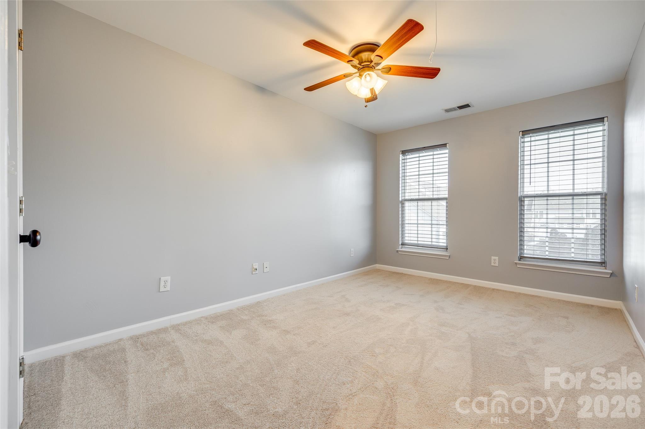 618 Bayou Circle Clover, SC 29710 - Photo 23 of 31 an empty room with windows and fan