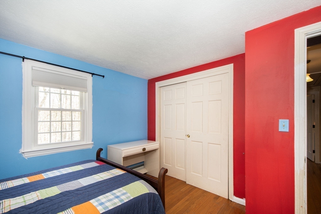 18 Longmeadow Road Scituate, MA 02066 - Photo 26 of 37 a bedroom with a bed and a window
