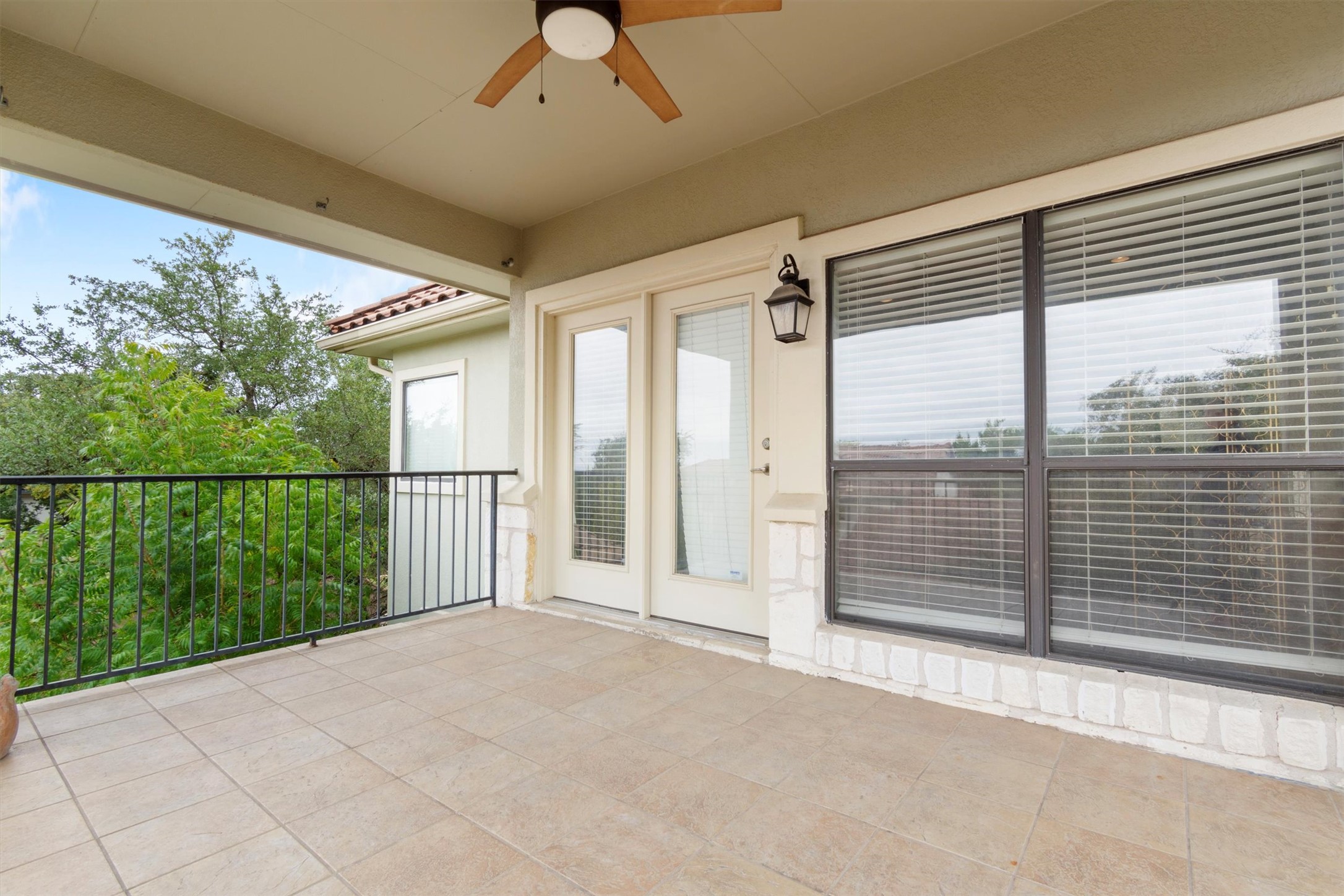 6 Monarch Oaks Lane Austin, TX 78738 - Photo 16 of 40 Balcony featuring a ceiling fan and a sunroom