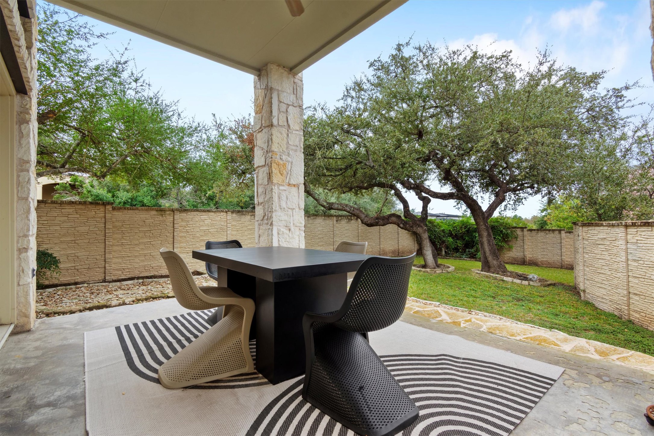 6 Monarch Oaks Lane Austin, TX 78738 - Photo 31 of 40 Fenced backyard featuring a patio and outdoor dining area