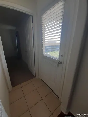 a view of a closet in an empty room