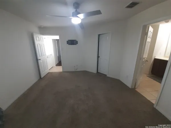 a view of empty room with windows