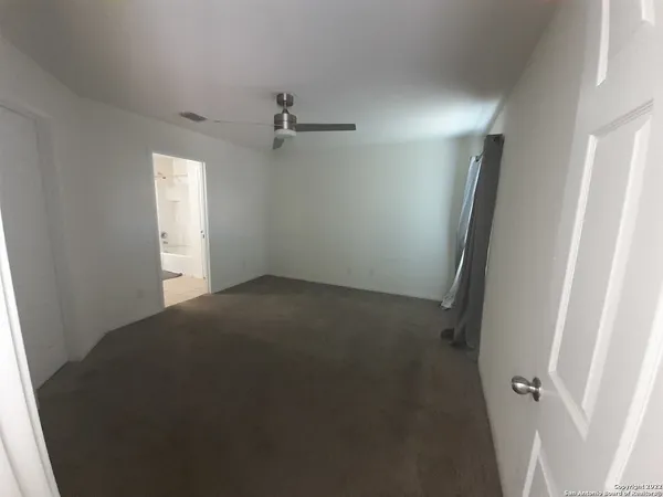a view of empty room with windows