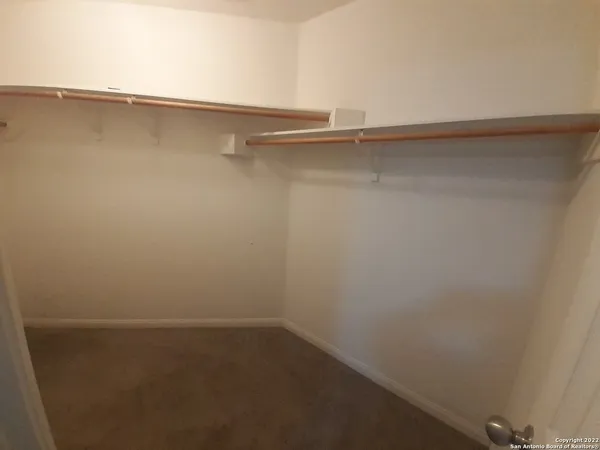 a view of a room with shelf on the wall