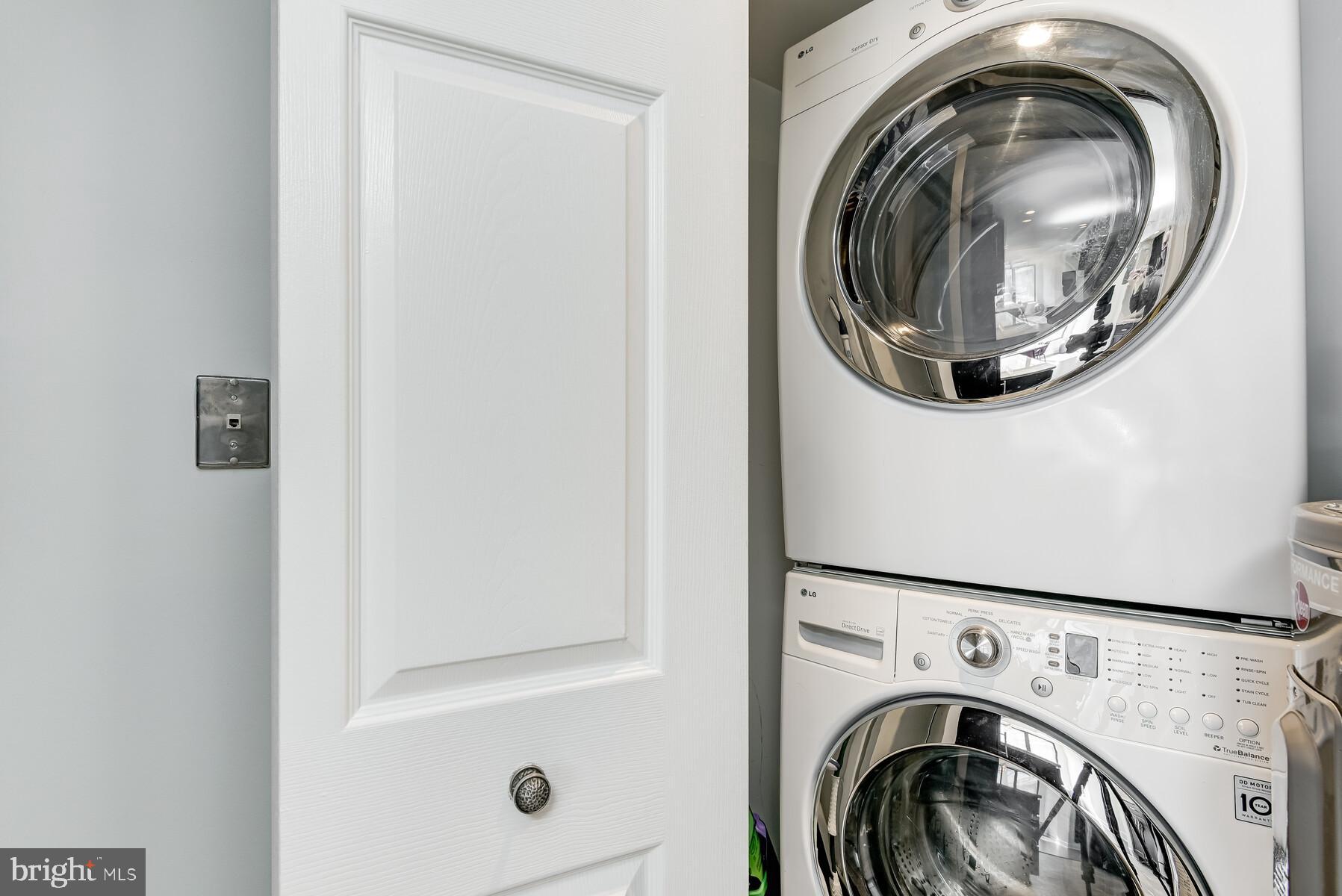 1080 Wisconsin Avenue Northwest, Unit 2001 Washington, DC 20007 - Photo 16 of 30 a utility room with dryer and washer