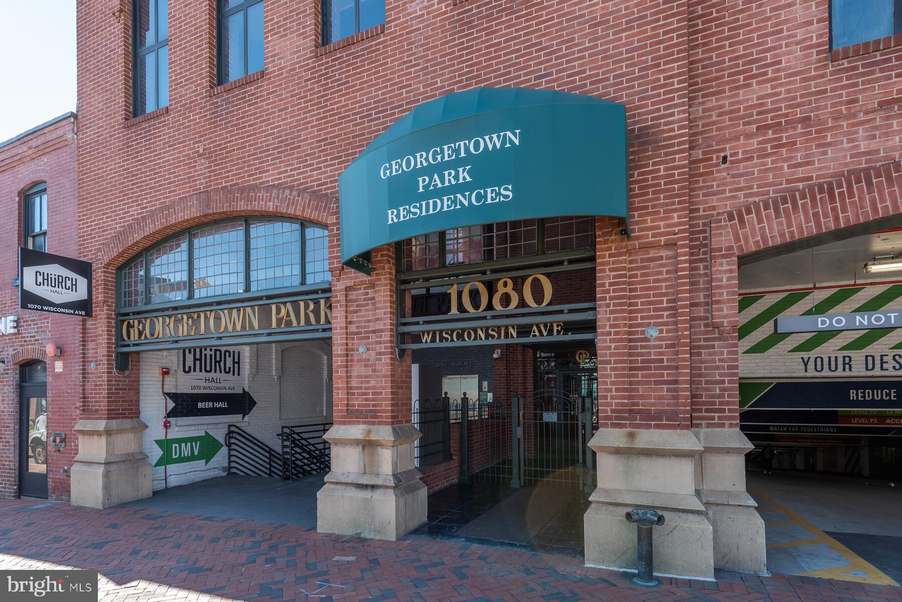 1080 Wisconsin Avenue Northwest, Unit 2001 Washington, DC 20007 - Photo 2 of 30 a front view of a building with entryway