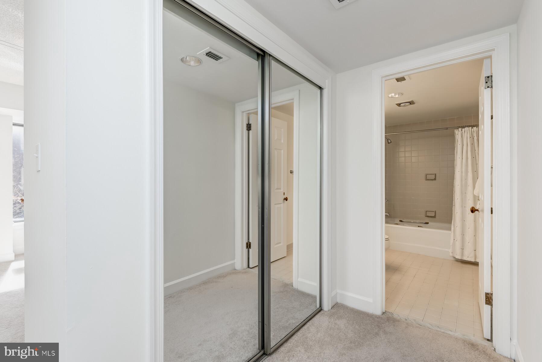 1080 Wisconsin Avenue Northwest, Unit 2001 Washington, DC 20007 - Photo 20 of 30 a view of a bathroom with a glass door