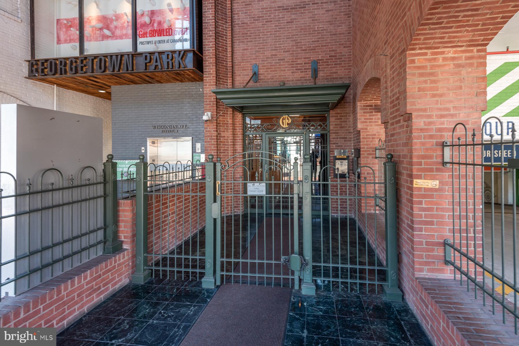 1080 Wisconsin Avenue Northwest, Unit 2001 Washington, DC 20007 - Photo 4 of 30 a view of a pathway with a building in the background