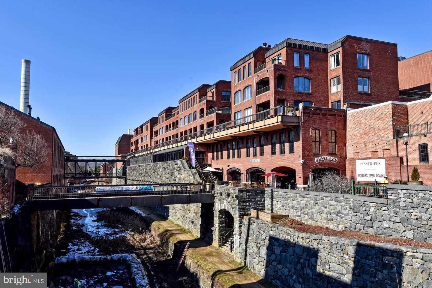 1080 Wisconsin Avenue Northwest, Unit 2001 Washington, DC 20007 - Photo 6 of 30 a front view of a building with glass windows