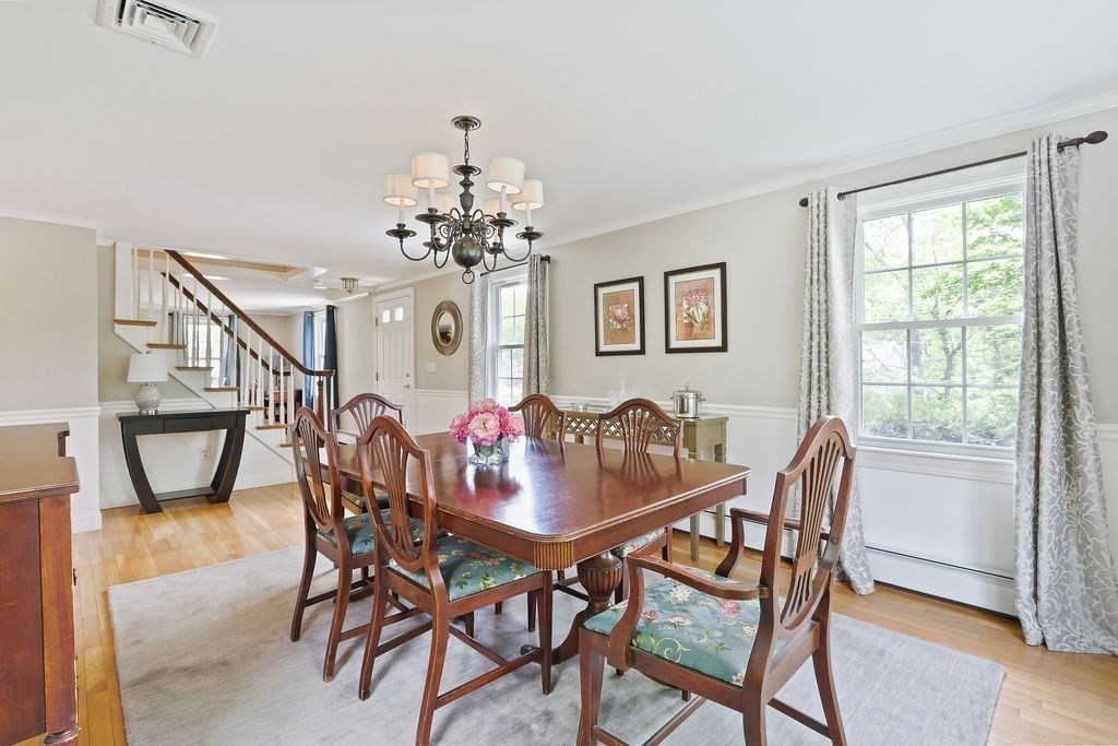 28 Appleton Road Needham, MA 02492 - Photo 11 of 24 a view of a dining room with furniture and chandelier