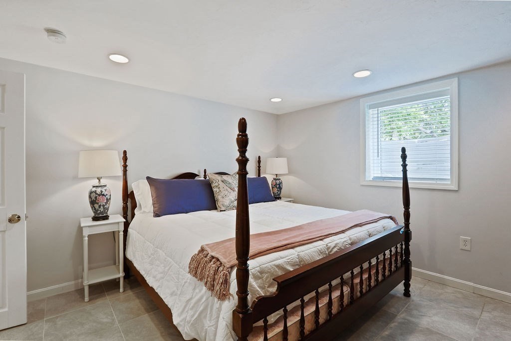 28 Appleton Road Needham, MA 02492 - Photo 18 of 24 a bed room with a bed and a window