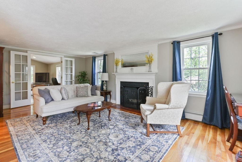 28 Appleton Road Needham, MA 02492 - Photo 8 of 24 a living room with furniture and a fireplace