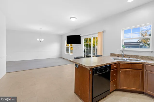 a kitchen with a sink and a stove