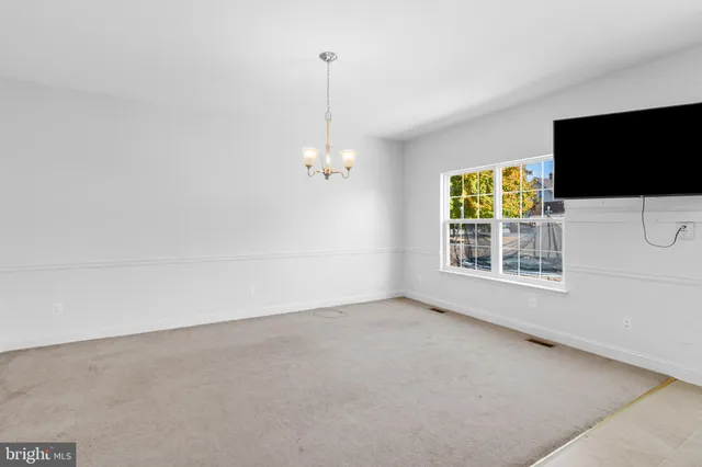 a view of a livingroom with a flat screen tv