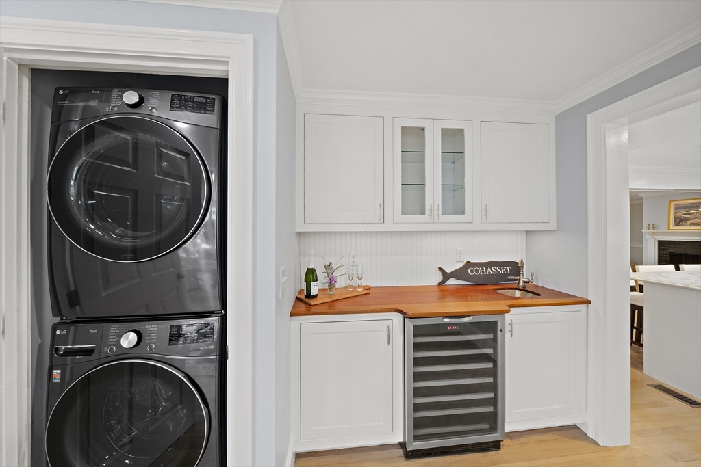 309 South Main Street Cohasset, MA 02025 - Photo 17 of 35 a view of a storage and utility room with washer and dryer