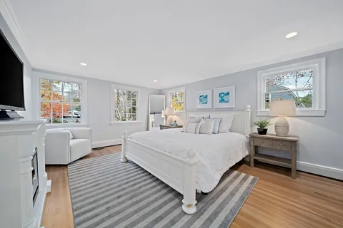 a spacious bedroom with a large bed and a couch