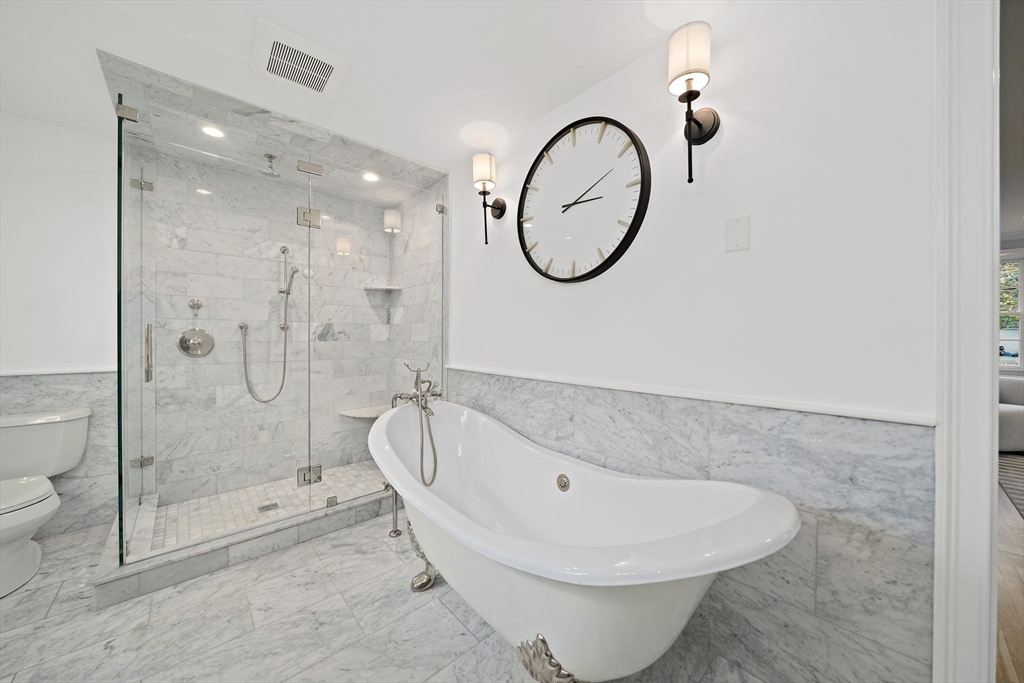 309 South Main Street Cohasset, MA 02025 - Photo 22 of 35 a bathroom with a sink a toilet and a mirror