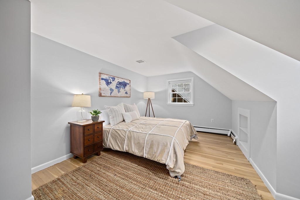 309 South Main Street Cohasset, MA 02025 - Photo 26 of 35 a bedroom with a bed and a table