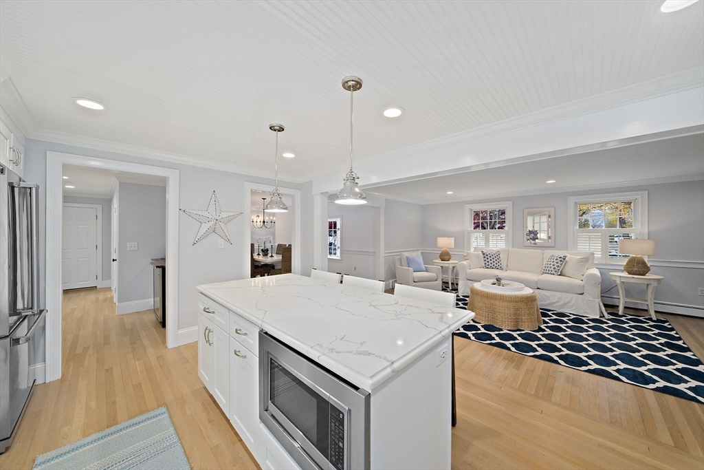 309 South Main Street Cohasset, MA 02025 - Photo 7 of 35 a open kitchen with stainless steel appliances granite countertop a stove and a refrigerator