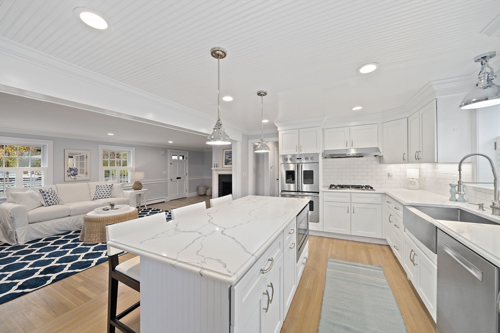 309 South Main Street Cohasset, MA 02025 - Photo 9 of 35 a large kitchen with kitchen island a sink appliances and cabinets