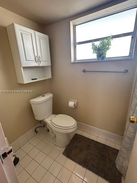 Kendale Lakes Miami, FL 33183 - Photo 13 of 19 a bathroom with a toilet a sink and a window