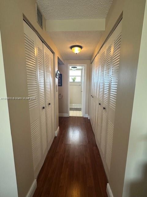 Kendale Lakes Miami, FL 33183 - Photo 14 of 19 a view of a hallway with wooden floor and closet area