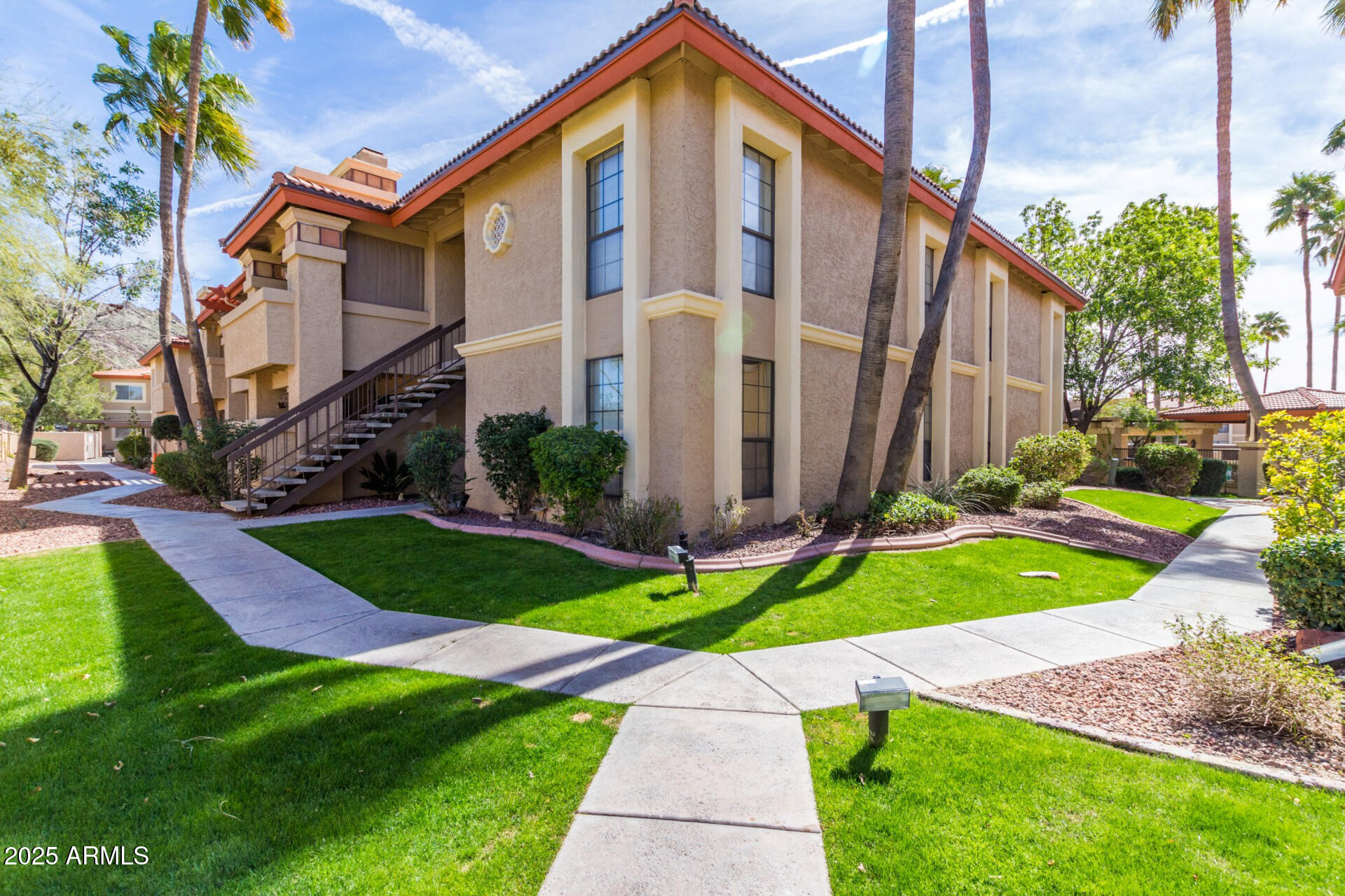 10410 North Cave Creek Road, Unit 2006 Phoenix, AZ 85020 - Photo 17 of 29 a front view of a house with garden