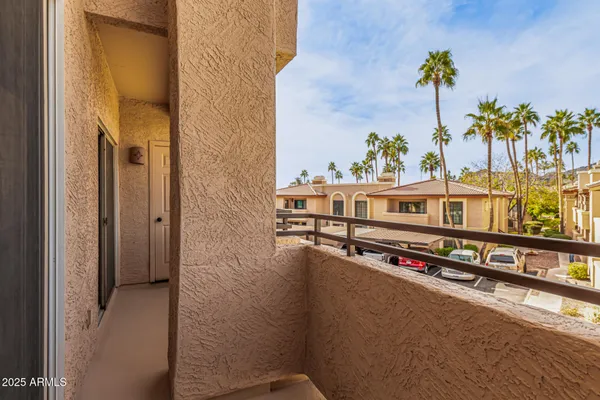 a view of a balcony with city view