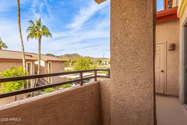 a view of a balcony with an outdoor space